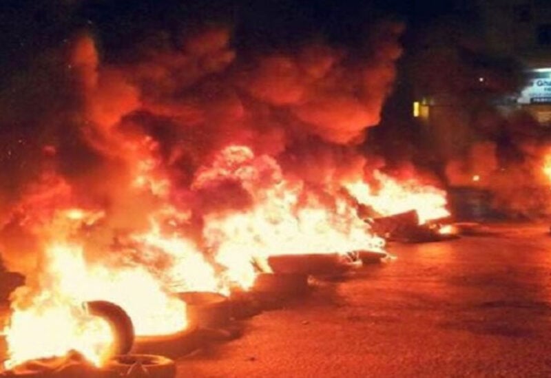 Protesters burn tires amid unprecedented surge in dollar