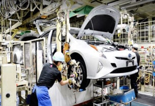 Toyota to cut production