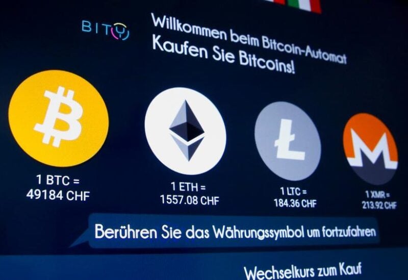 The exchange rates and logos of Bitcoin (BTH), Ether (ETH), Litecoin (LTC) and Monero (XMR) are seen on the display of a cryptocurrency ATM of blockchain payment service provider Bity at the House of Satochi bitcoin and blockchain shop in Zurich, Switzerland March 4, 2021.