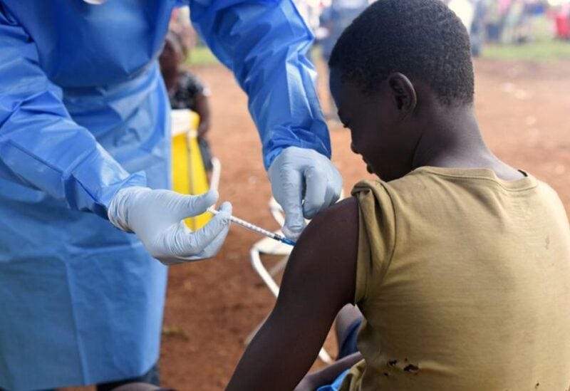 FILE PHOTO: A Congolese health worker administers Ebola vaccine to a boy who had contact with an Ebola sufferer in the village of Mangina in North Kivu province of the Democratic Republic of Congo, August 18, 2018.