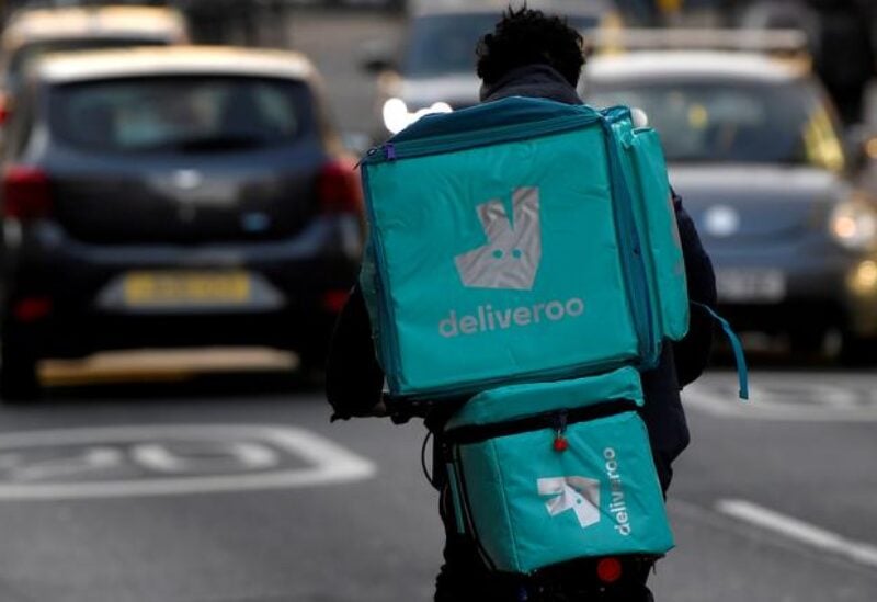 FILE PHOTO: A Deliveroo delivery rider cycles in London, Britain, March 8, 2021.