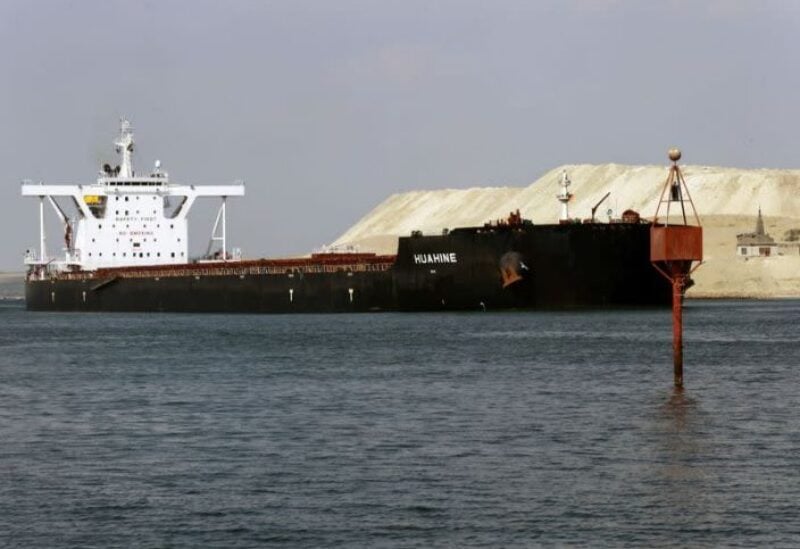 FILE PHOTO: A ship is seen after sailing through Suez Canal as traffic resumes after a container ship that blocked the waterway was refloated, in Ismailia, Egypt, March 30, 2021.