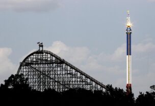 FILE PHOTO: The Texas Giant roller coaster ride (L) is seen at the Six Flags Over Texas amusement park in Arlington, Texas July 23, 2013.