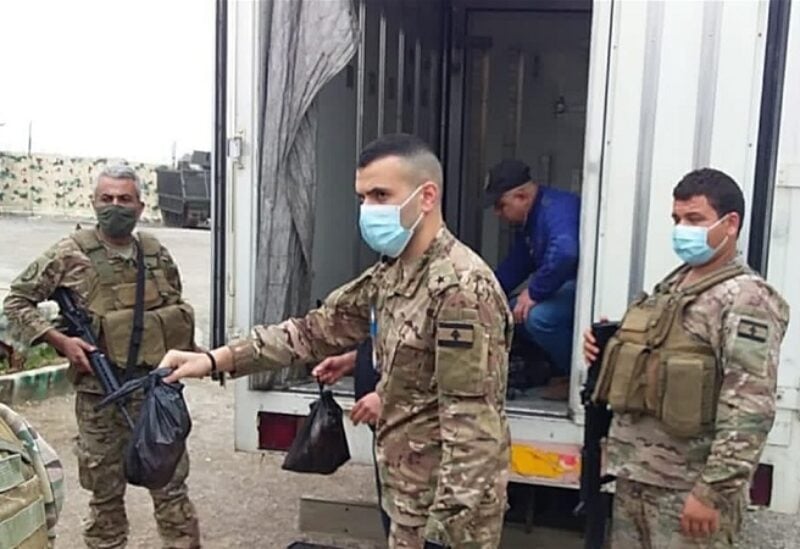 A picture showing Lebanese army units distributing foodstuffs to the families in need in the northern city of Tripoli on March 22, 2021.