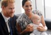 Prince Harry and his wife, Meghan Markle, holding their baby.