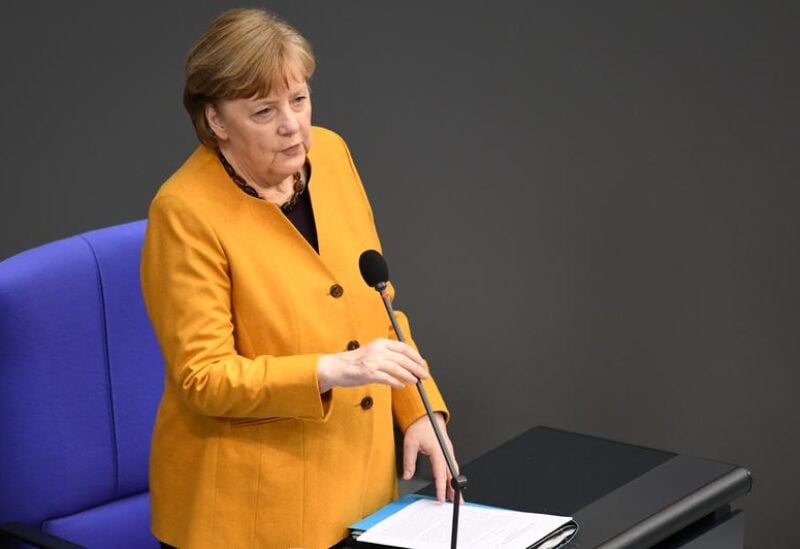 FILE PHOTO: German Chancellor Angela Merkel answers questions during a plenum session of the lower house of parliament, the Bundestag, in Berlin, Germany, March 24, 2021.