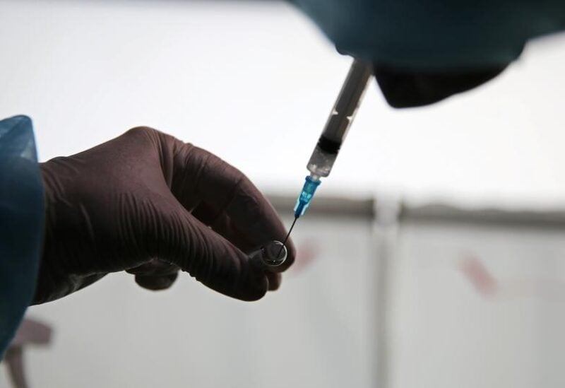 FILE PHOTO: A medical worker prepares a dose of the Sputnik V (Gam-COVID-Vac) vaccine against the coronavirus disease (COVID-19) in the town of Tulun in Irkutsk Region, Russia March 16, 2021.