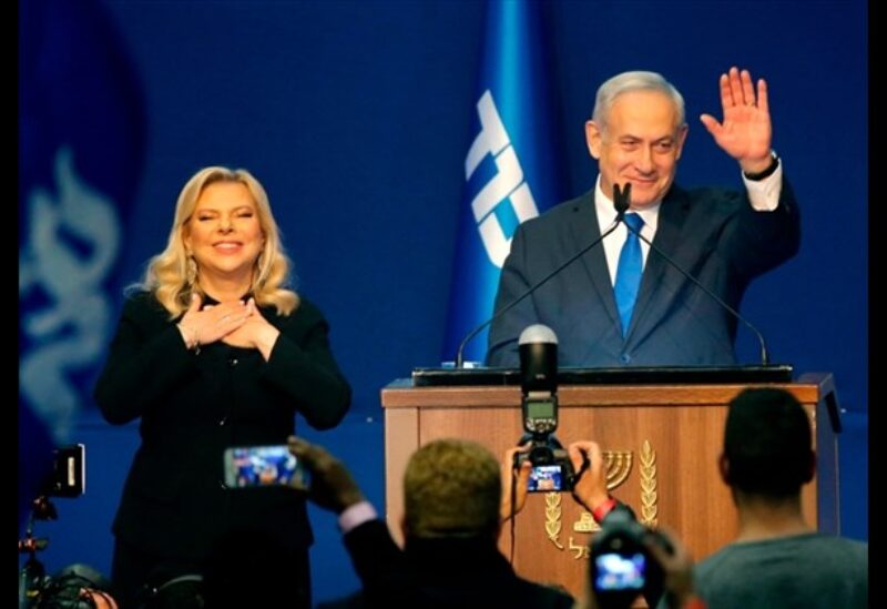 Israeli Prime Minister Benjamin Netanyahu and his wife Sara address supporters at the Likud party campaign headquarters in the coastal city of Tel Aviv early on March 3, 2020, after polls officially closed.