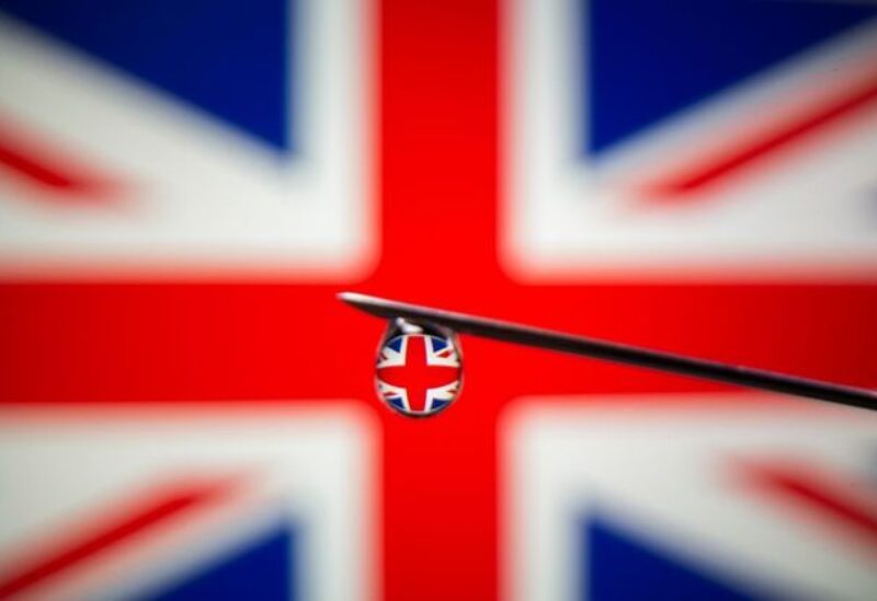 FILE PHOTO: UK flag is reflected in a drop on a syringe needle in this illustration photo taken March 16, 2021.