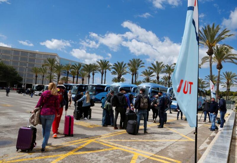 FILE PHOTO: Tourists from Germany arrive at Palma de Mallorca Airport following Berlin's lifted quarantine requirement for travellers returning from the Balearic Islands amid the coronavirus disease (COVID-19) pandemic, Palma de Mallorca, Spain March 21, 2021.