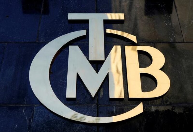 FILE PHOTO: A logo of Turkey's Central Bank (TCMB) is pictured at the entrance of the bank's headquarters in Ankara, Turkey April 19, 2015.