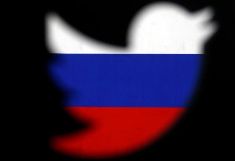 FILE PHOTO: 0A 3D-printed Twitter logo displayed in front of Russian flag is seen in this illustration picture, October 27, 2017.
