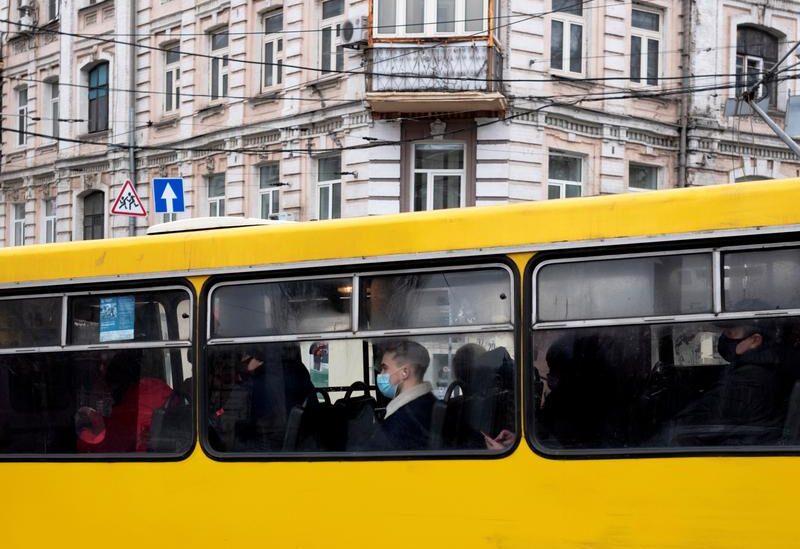 FILE PHOTO: A passenger wearing a protective face mask is seen on a bus amid the coronavirus disease (COVID-19) pandemic in central Kyiv, Ukraine January 27, 2021.
