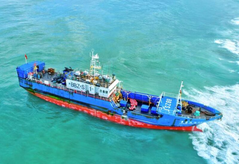 A Chinese-flagged trawler that ran aground containing 130 tonnes of oil, is seen in the Indian Ocean waters at Pointe Aux Sables, on the western coast of the island of Mauritius, March 8, 2021.