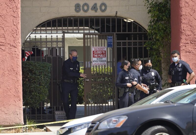 Los Angeles Police Chief Michel Moore exits an apartment complex as police investigate in Reseda