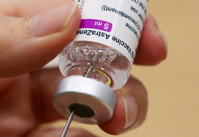 FILE PHOTO: A medical worker prepares a dose of Oxford/AstraZeneca's COVID-19 vaccine at a vaccination center in Antwerp, Belgium March 18, 2021.