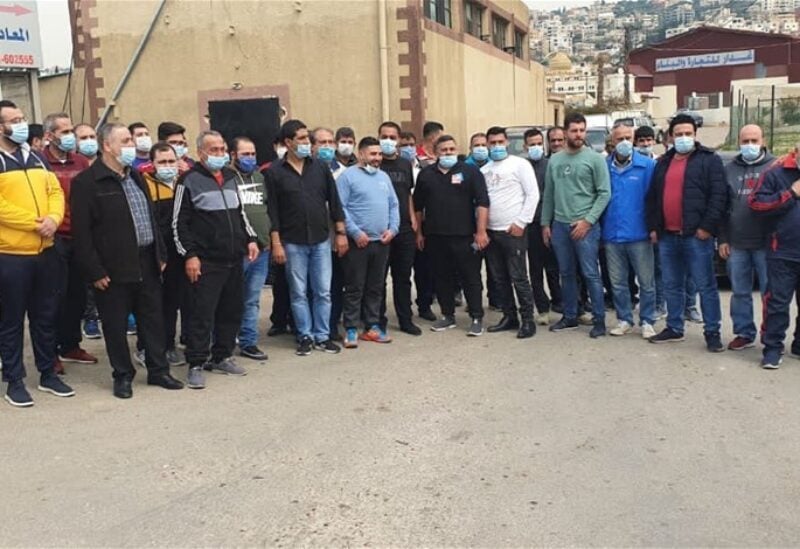 Butcher shop owners staging a sit-in outside the slaughterhouse of Al Ghaziyeh