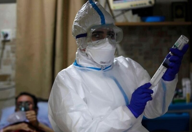 A nurse attends to COVID-19 patients at Al-Hamshari Hospital in Sidon, Feb. 8, 2021.