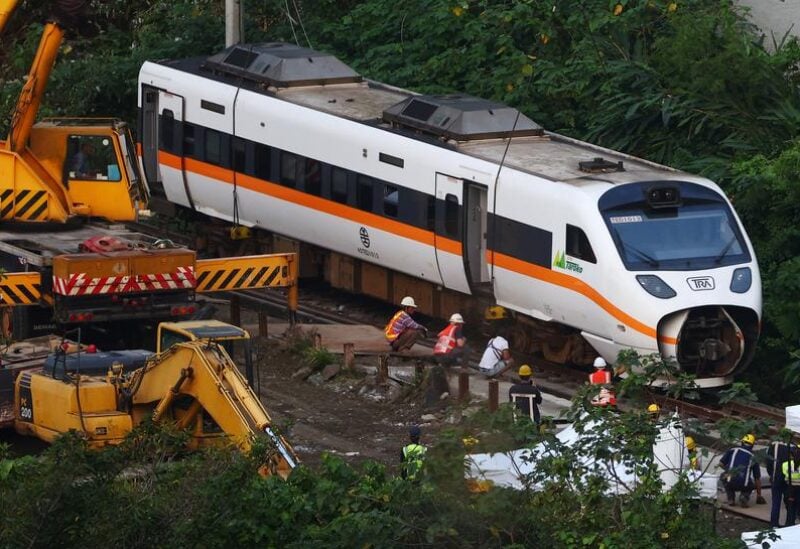 Rescuers work at the site a day after a deadly train derailment at a tunnel north of Hualien, Taiwan April 3, 2021.