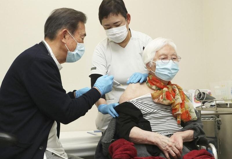 An elderly woman receives a coronavirus disease (COVID-19) vaccine shots at a nursery home in Tsu in Mie Prefecture, central Japan, April 12, 2021.