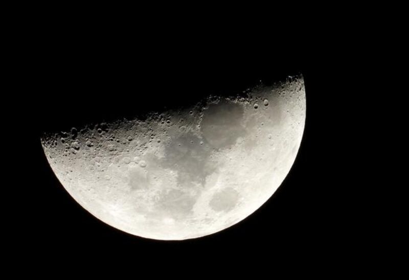 FILE PHOTO: Moon is seen in the sky during the closest visible conjunction of Jupiter and Saturn in 400 years, in Tejeda, on the island of Gran Canaria, Spain December 21, 2020.