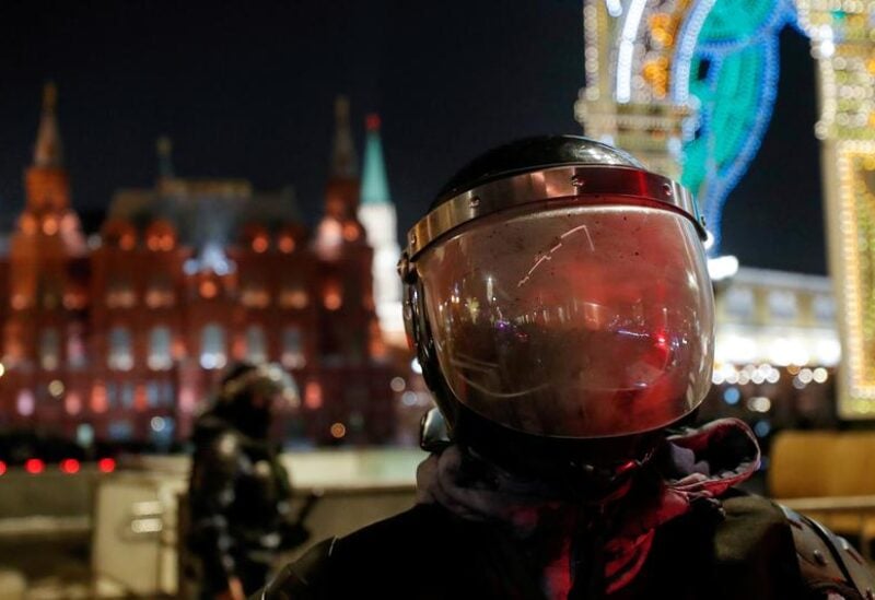 FILE PHOTO: A riot police officer stands guard in front of the Kremlin after Russian opposition leader Alexei Navalny was sentenced to three and a half years in jail, in Moscow, Russia February 2, 2021.