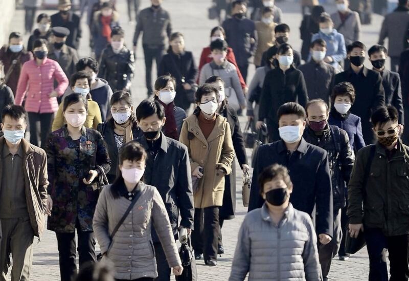 FILE PHOTO: People wearing protective face masks commute amid concerns over the new coronavirus disease (COVID-19) in Pyongyang, North Korea March 30, 2020, in this photo released by Kyodo. Mandatory credit Kyodo/via REUTERS