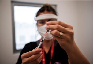 A nurse prepares a dose of the Pfizer-BioNTech coronavirus disease (COVID-19) vaccine at Ankara City Hospital in Ankara, Turkey, April 2, 2021.