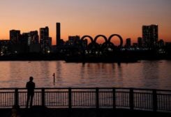 FILE PHOTO: The giant Olympic rings are silhouetted in the sunset, amid the coronavirus disease (COVID-19) outbreak, in Tokyo, Japan, January 13, 2021.