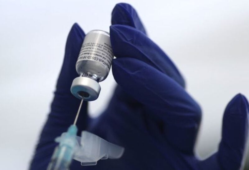 FILE PHOTO: A healthcare worker prepares a Pfizer coronavirus disease (COVID-19) vaccination in Los Angeles, California, U.S., January 7, 2021.