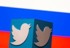 FILE PHOTO: A 3D-printed Twitter logo is pictured in front of a displayed Russian flag in this illustration taken March 10, 2021.