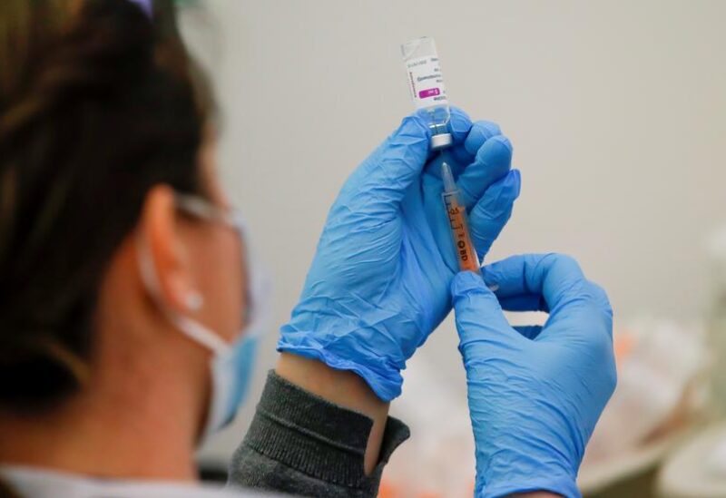 FILE PHOTO: A dose of the AstraZeneca COVID-19 vaccine is prepared in a vaccination center at Newmarket Racecourse, amid the coronavirus disease outbreak in Newmarket, Britain March 26, 2021.