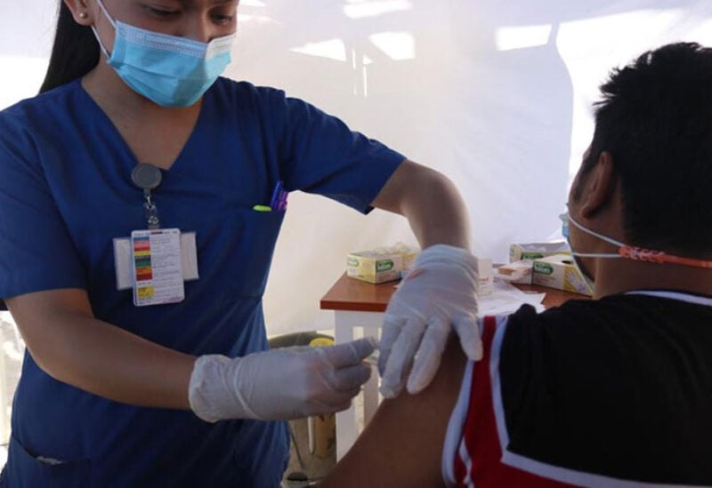 A man receiving Covid-19 vaccine at a center in Abu Dhabi