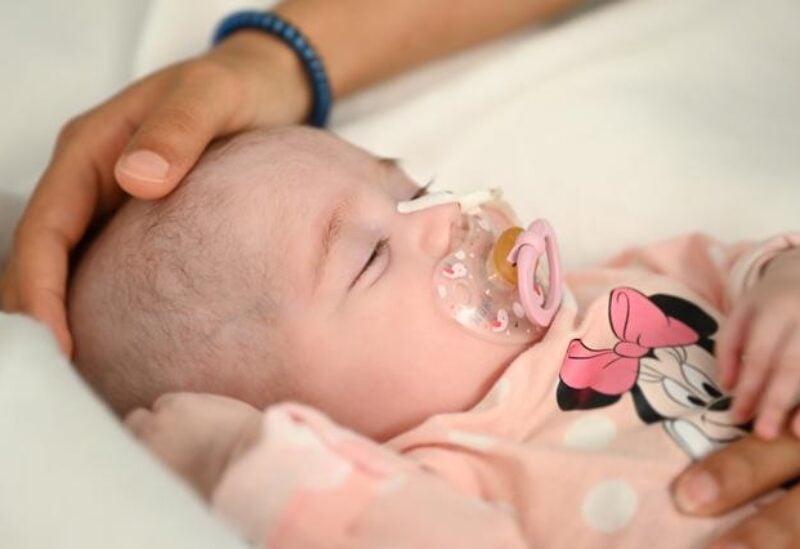 Two-month old Spanish baby girl Naiara, who received a heart transplant in a pioneering surgery where doctors used a heart that had already stopped beating from a donor with a different blood type, is seen in this handout picture released May 17, 2021 by Gregorio Maranon Hospital in Madrid, Spain. REUTERS