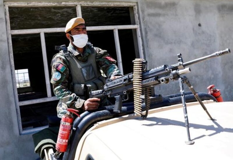 An Afghan National Army soldier sits on a back of an army vehicle at a checkpoint on the outskirts of Kabul, Afghanistan April 21, 2021. REUTERS