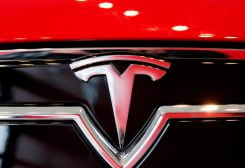 A Tesla Motors logo is shown on a Tesla Model S at a Tesla Motors dealership at Corte Madera Village, an outdoor retail mall, in Corte Madera
