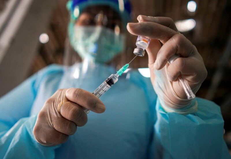 FILE PHOTO: A health worker prepares to administer the Sinovac coronavirus disease (COVID-19) vaccine at a market after hundreds of local residents in the district tested positive for COVID-19 in Bangkok, Thailand, March 17, 2021. REUTERS