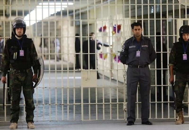 A file photo shows guards stand at a cell block at the renovated Abu Ghraib prison in Baghdad, Iraq on Feb 21, 2009. (AP)