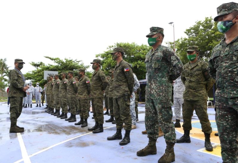 Armed Forces of the Philippines Chief of Staff Cirilito Sobejana (L) addresses soldiers during a visit to the Philippines-claimed Thitu Island in the South China Sea on June 7, 2021. Picture released for publication on June 9, 2021. Armed Forces of the Philippines/Handout via REUTERS