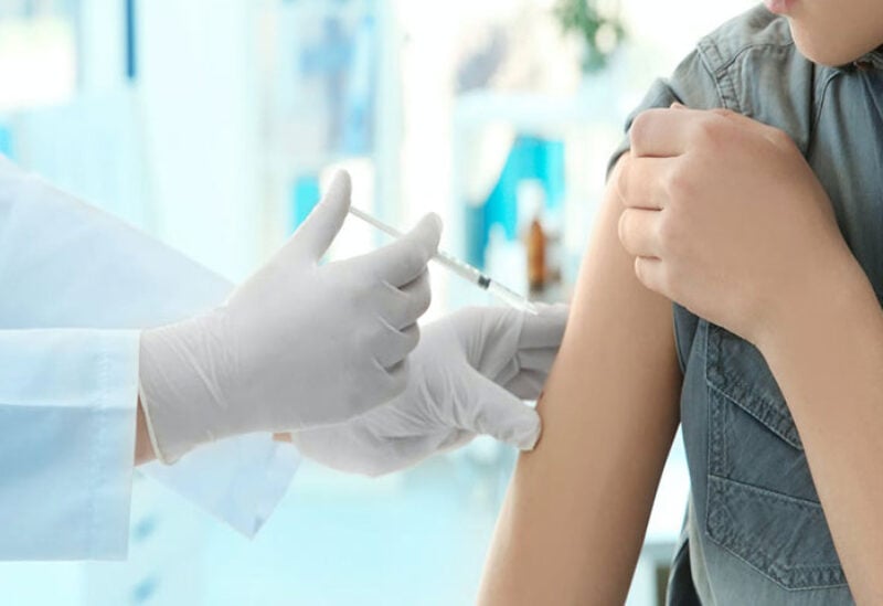 Teenagers receiving Covid-19 vaccine shot