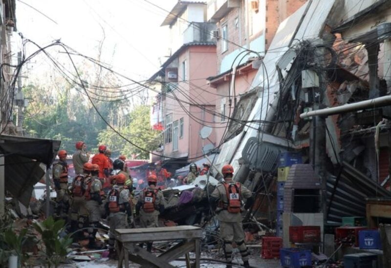 Firefighters search for victims between the debris of a collapsed building in Rio das Pedras slum, Rio de Janeiro, Brazil, June 3, 2021. REUTERS/Ricardo Moraes