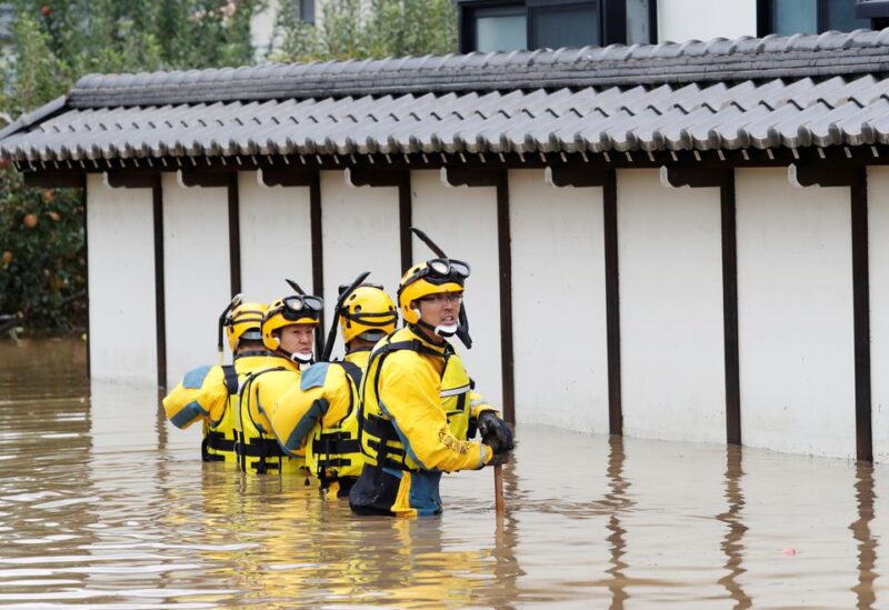 Police search a flooded area in the aftermath of Typhoon Hagibis, which caused severe floods at the Chikuma River in Nagano Prefecture, Japan, October 14, 2019. REUTERS/Kim Kyung-Hoon/File Photo