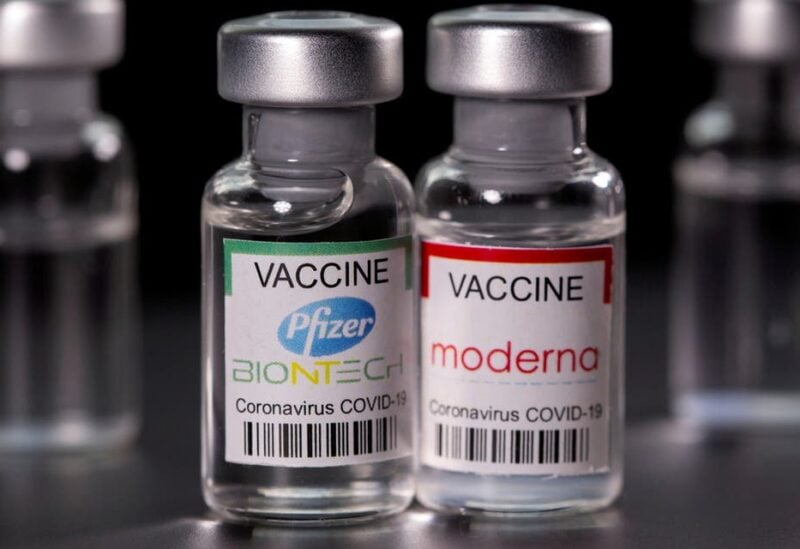 Vials with Pfizer-BioNTech and Moderna coronavirus disease (COVID-19) vaccine labels are seen in this illustration picture taken March 19, 2021. (File photo: Reuters)