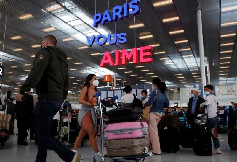 Passengers line up to check in inside the Terminal 3 at Orly Airport, near Paris, France, on July 1, 2021. (Reuters)