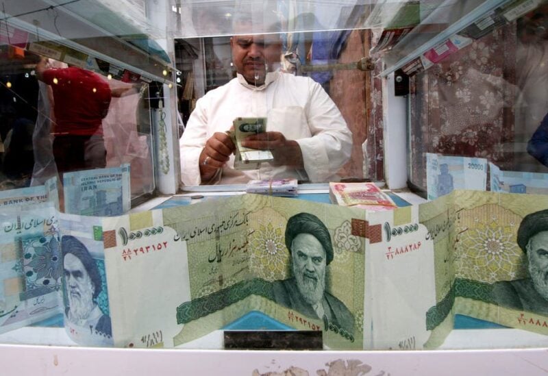 A man counts Iranian rials at a currency exchange shop, before the start of the U.S. sanctions on Tehran, in Basra, Iraq November 3, 2018. (Reuters)