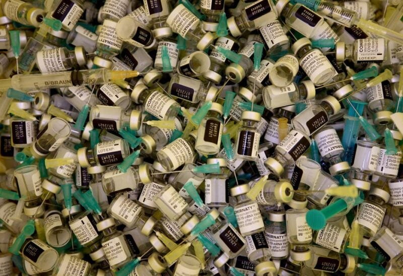 Empty Pfizer-BioNTech COVID-19 vaccine vials and syringes are seen in a disposal container at Austria Center, which has been set up as a coronavirus disease mass vaccination centre, in Vienna, Austria April 22, 2021. (File photo: Reuters)