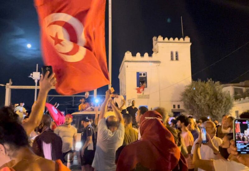 Crowds gather on the street after Tunisia's president suspended parliament, in La Marsa, near Tunis, Tunisia July 26, 2021, in this still image obtained from a social media video. (Reuters)