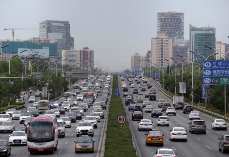 FILE PHOTO: Cars drive on the road during the morning rush hour in Beijing, China, July 2, 2019. REUTERS/Jason Lee/File Photo