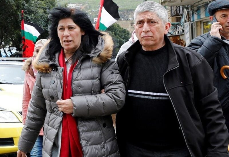 File photo of Khalida Jarrar, a senior Popular Front for the Liberation of Palestine's (PFLP) political figure, walks with people after she was released from an Israeli jail, in Nablus, in the Israeli-occupied West Bank, on February 28, 2019. (Reuters)
