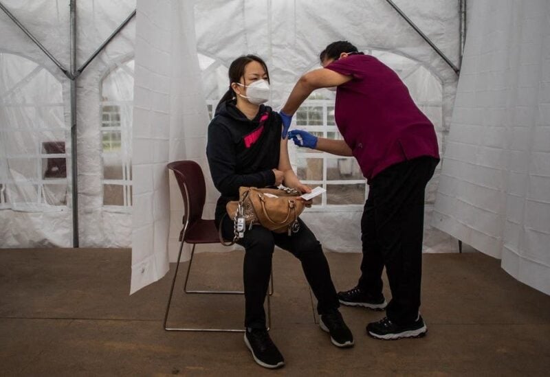 A nurse administers the Moderna Covid-19 vaccine at Kedren Community Health Center, in South Central Los Angeles, California. (AFP)